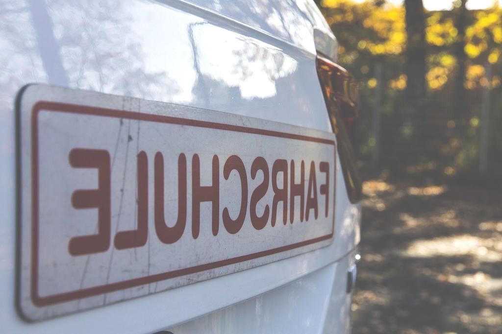Art instructor guiding student in drawing